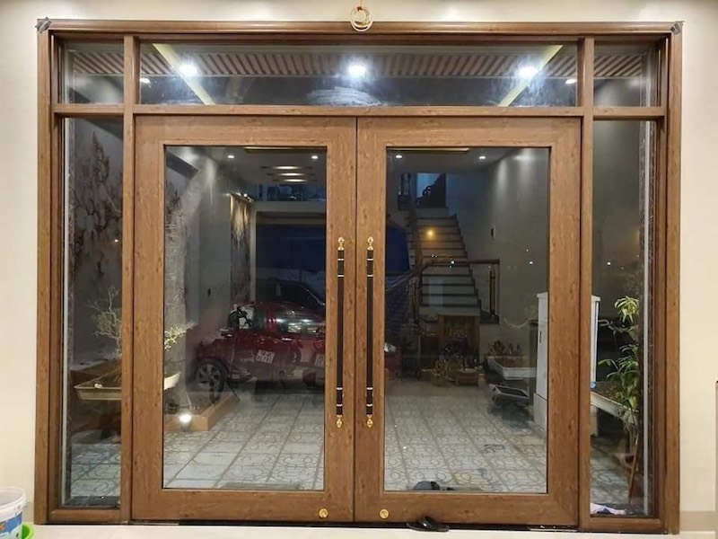 cửa kính thuỷ lực khung nhôm